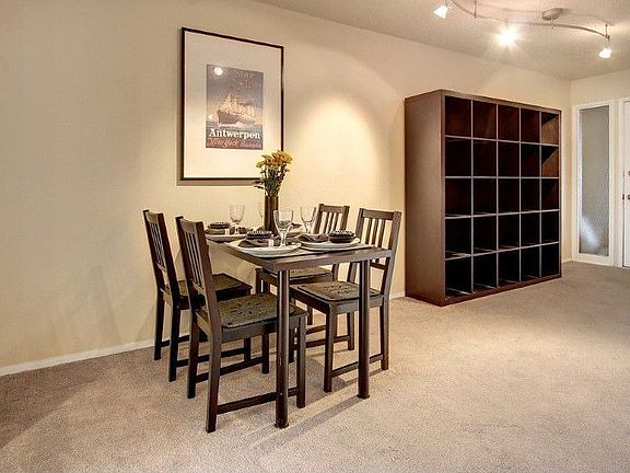 Dining area adjoins Living Room, with front entry shown at far right.
