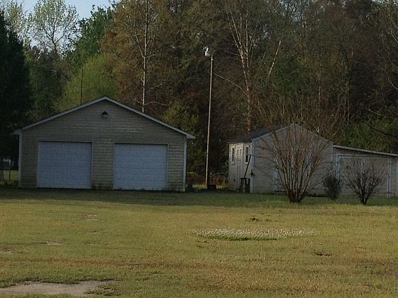 Double Car Garage with two sheds