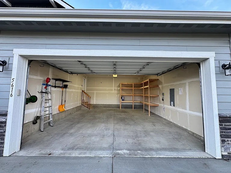 2-car garage with built-in shelving
