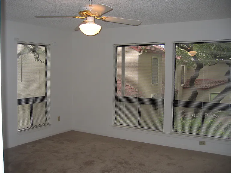 Rear bedroom with lakeview from leftmost window