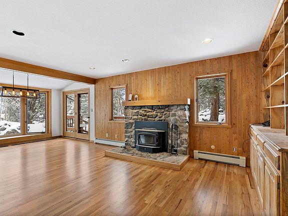 Living room with wood-burning fireplace