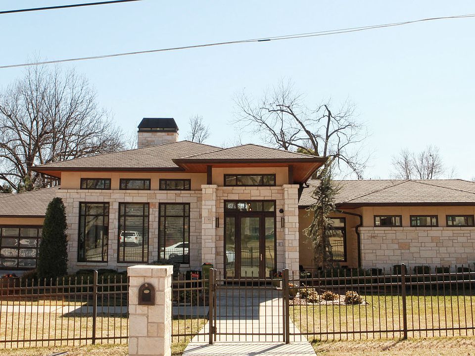 Contemporary home with stunning architectural details situated on 3/4 of an acre.