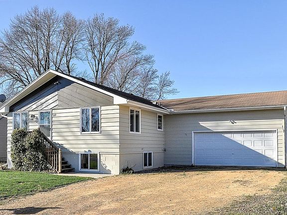 Spacious two car garage with rear service door.