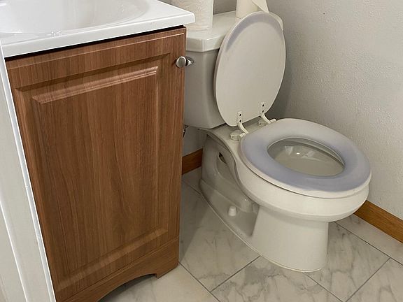 1.75 bathroom : New vanity, tile floor and door.