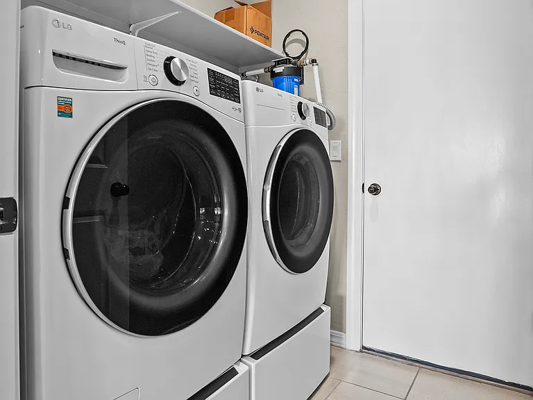 Laundry room with LG Washer and Dryer.