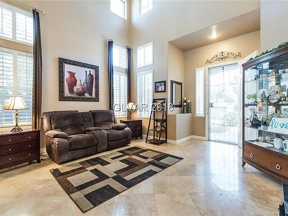 Entry to Formal Living Room. Vaulted Ceilings . Travertine Floors Shutters