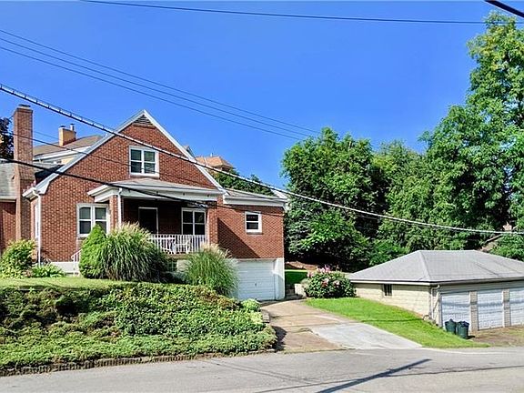 Corner lot. House comes with 1 integral garage and a 3 car detached. and a LARGE back yard.