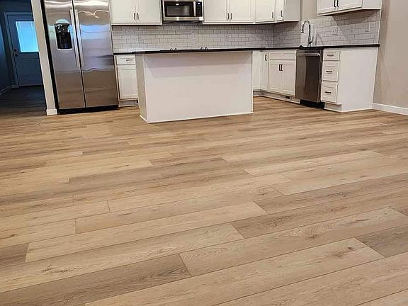 living area view into kitchen