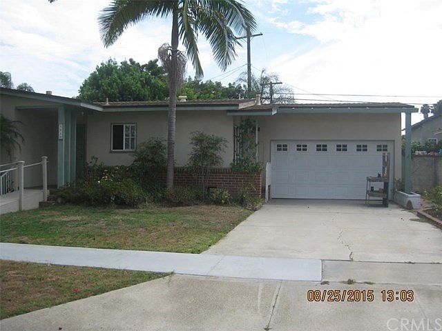 Brick trimmed front, dual paned windows and a double garage with cement drive