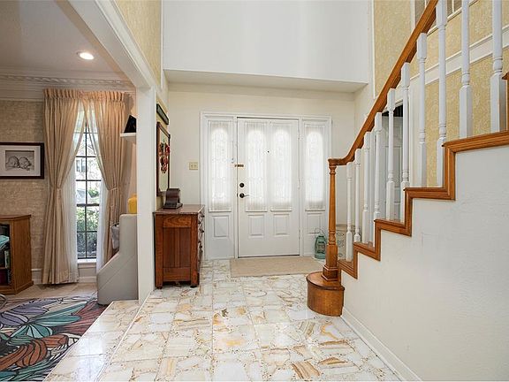 First look into home welcomes you with high ceilings and spacious yet warm greeting.