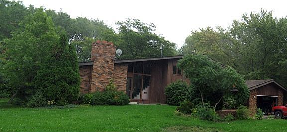 Surrounded with large trees.