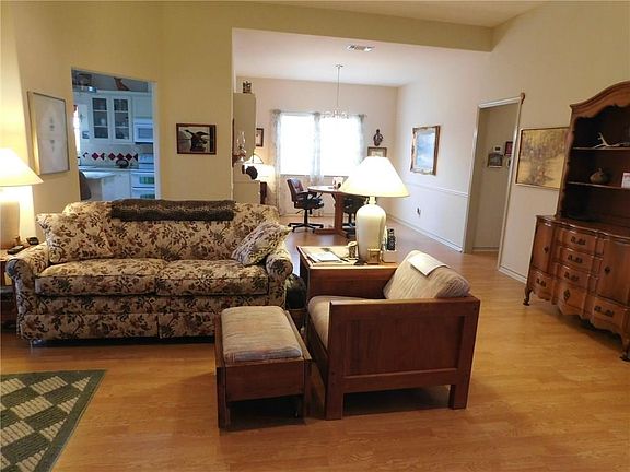 ANOTHER VIEW OF THE LIVING SPACE IN THE HOME.