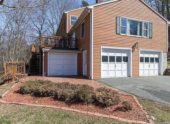 There are three garage bays. The 3rd bay is perfect for a hobby sportscar or motorcycle and garden equipment.