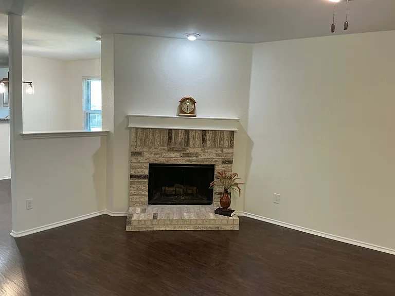 Living has fireplace and ceiling fan
