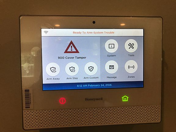 Honeywell touchpad controls for automating the lights and temperature.