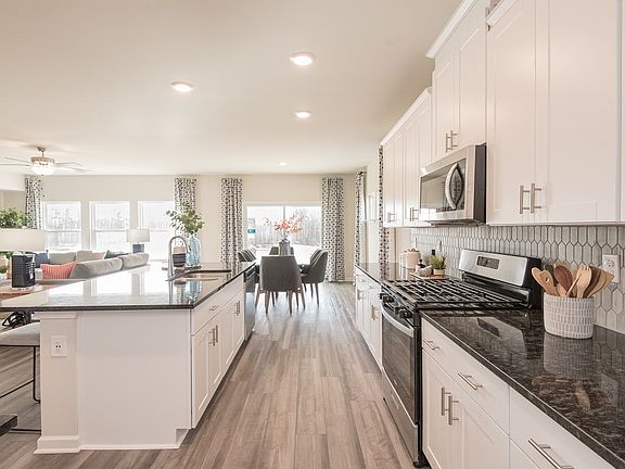 Cook dinner while the kids do homework at the spacious kitchen island.