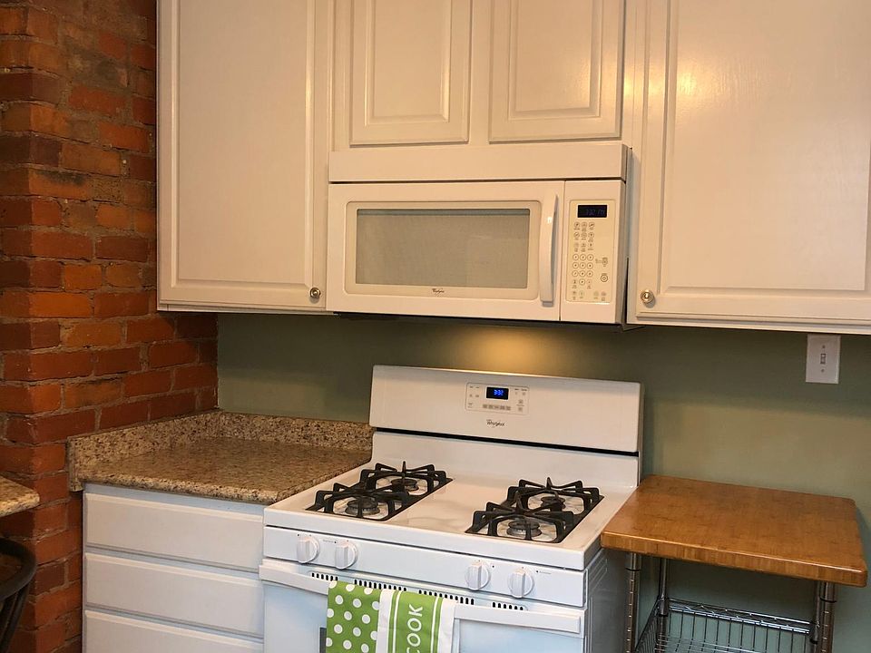 Kitchen with exposed brick