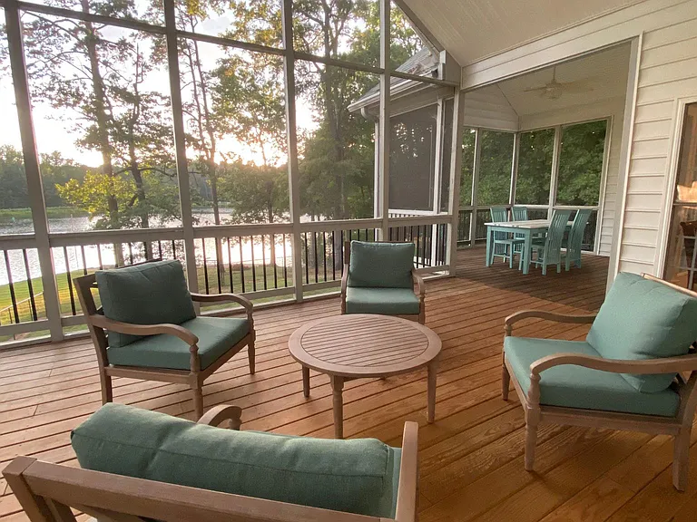 Screened porch with sitting and dining areas