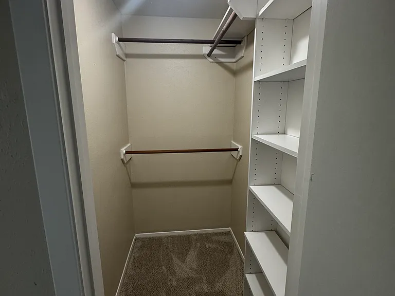 Spacious walk in closet in the primary bedroom.