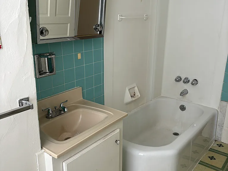 Tub and shower in bathroom.