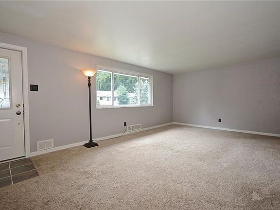 The soft lavender wall paint, white trim, and plush carpet means you don't have to do any work to make this space livable.