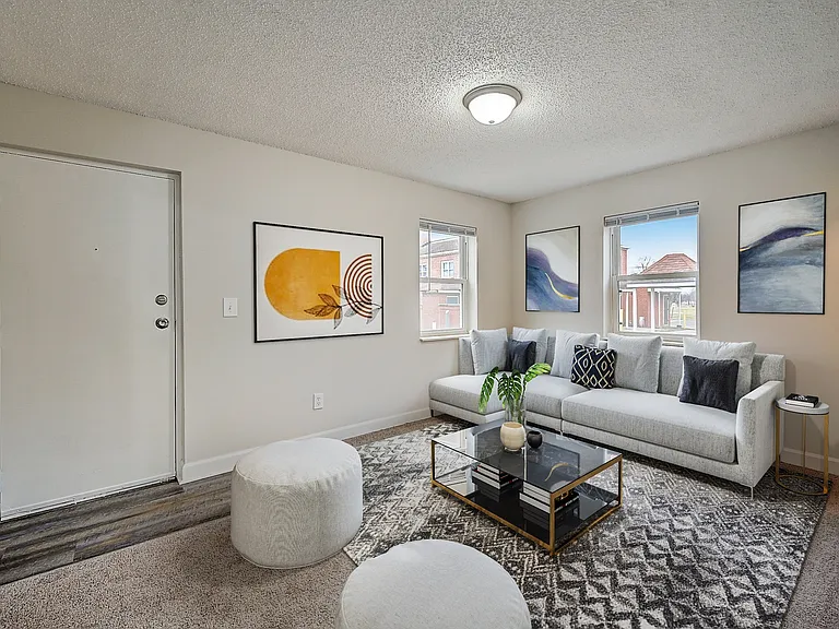 3 BR 2 BA Recently Renovated Townhouse Style Apartments featuring New gray carpet, Neutral paint scheme, Premium hardwood-style flooring, Neutral paint scheme, Upgraded light fixtures, New cabinets, Matching stainless steel appliances, Washer/Dryer, Air c