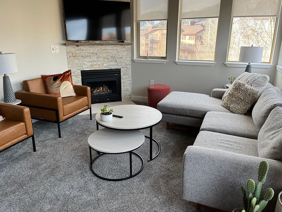 Sun-drenched living area with view of Olympic Park.