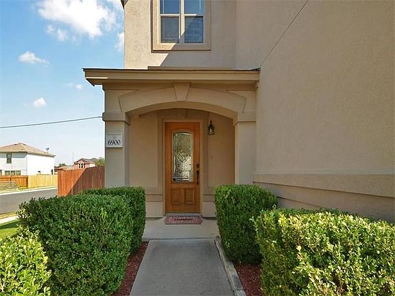 No steps leading into the home for easy access. Isn't the front door charming?
