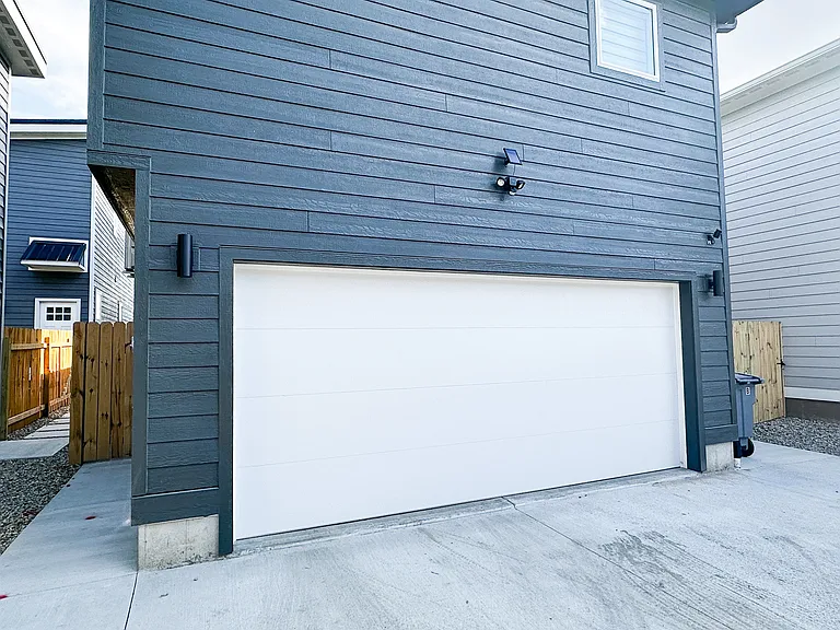 Large 2 Stall Garage with Parking Pad Outside that can accommodate 2 additional cars