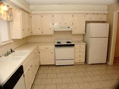 Kitchen with lots of cabinets, counter space, eating area