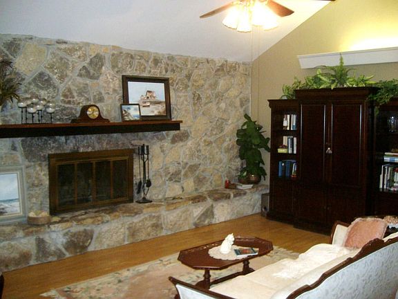 Den with stone wall