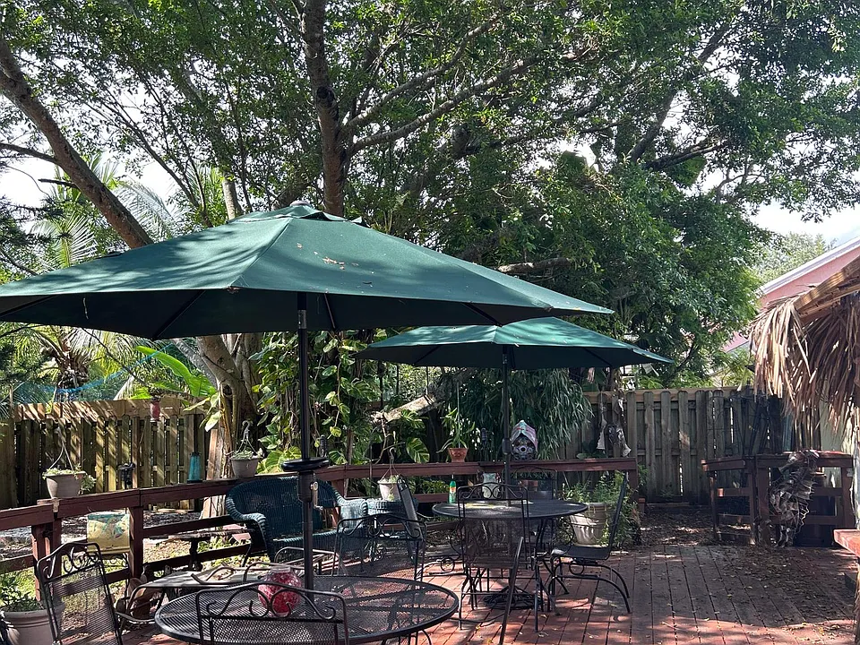 Seating area on deck with large shade trees covering deck 
Great for BBQ parties