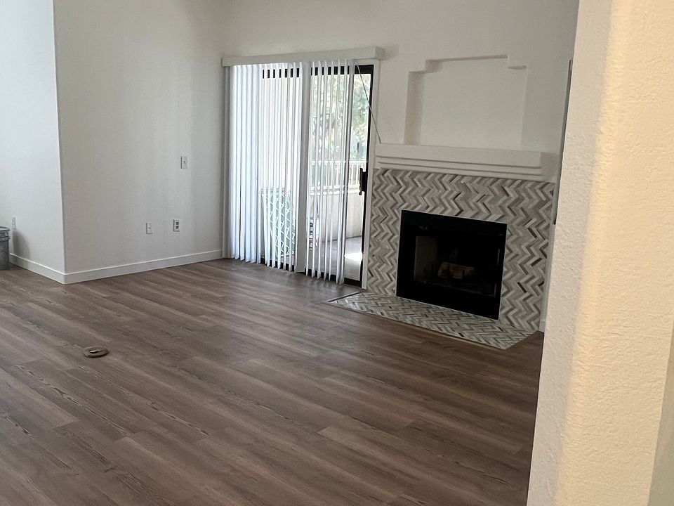 Living room with fire place and sliding door to patio