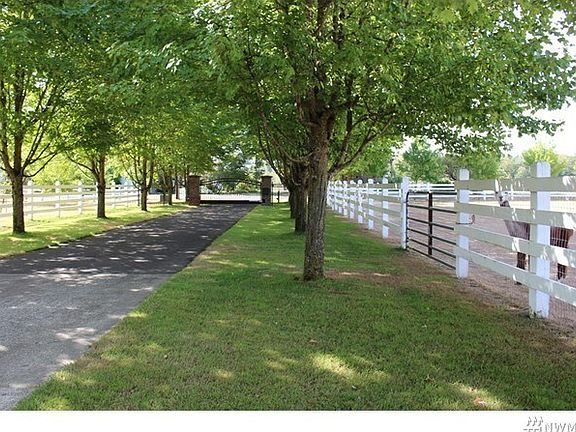 Paved private drive way with private gate to home and acreage.