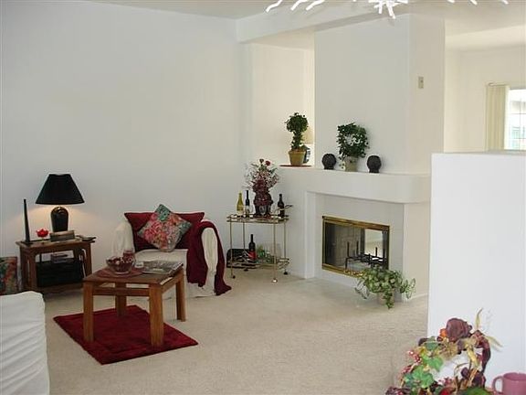 Dual sided fireplace in this Light and Open Floorplan