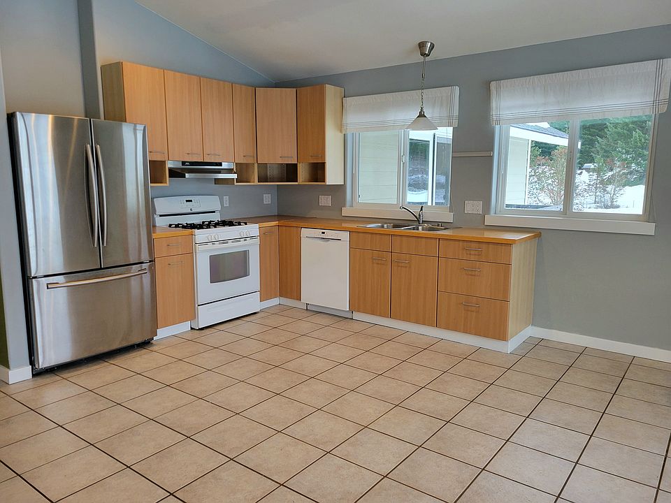 Kitchen in one corner of the great room.