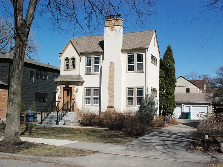 Wide driveway on south side of home means a lot of sun in "office," dining room and living room during winter months!