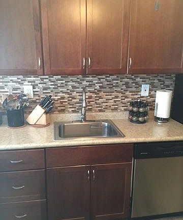 New kitchen with stainless appliances (including dishwasher