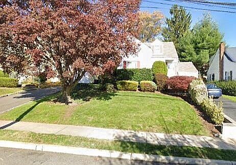 Front yard and driveway/garage