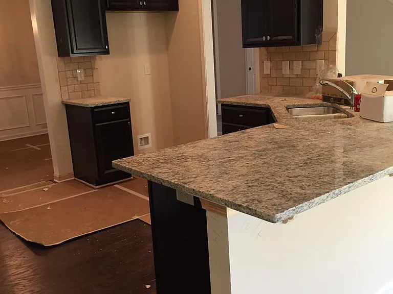 Upgraded kitchen with expresso cabinets. Fridge is included