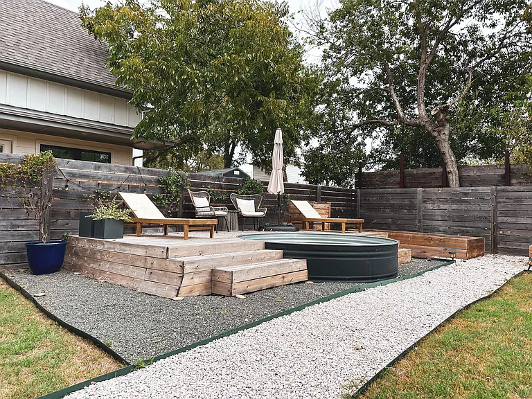 Stock tank pool and backyard area