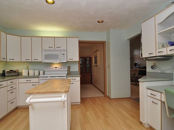 Kitchen includes a handy desk area, full pantry and additional storage.