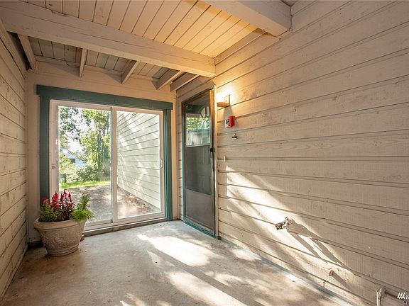 You will walk down the stairs to your own private breezeway to the front door and the slider will take you out to the common area. >
