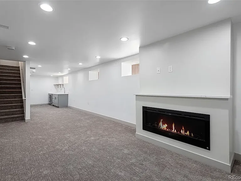 Second view of large living space in basement