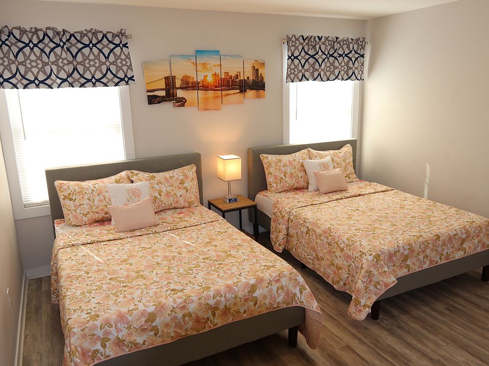 Spacious bedroom with private ensuite bathroom for added convenience.