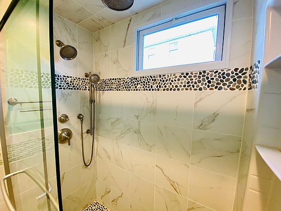 Three shows head with rain shower