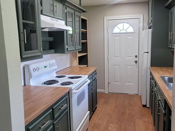 Gorgeous Kitchen with Glass Front Cabinets and large pantry
