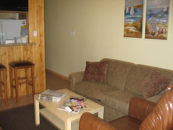 Living Room With Queen Size Sleeper Sofa & Recliner.
