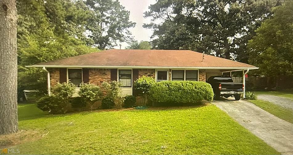 The front, and if you peak in the back, there is a White Oak tree with a swing on it.