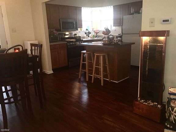 Modern kitchen with island and seating for 2.